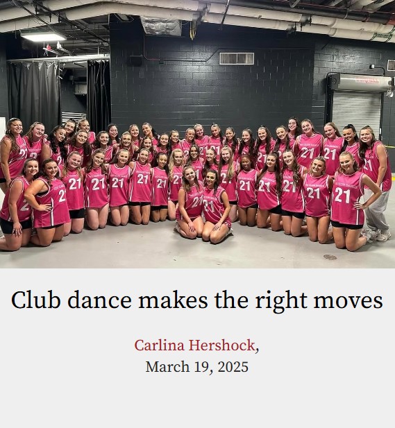Photo of approximately 30 white college students that are apart of an all-girl university club dance team. The girls are wearing pink jerseys with the number 21 on them. They are hugging each other and posing backstage of an arena.